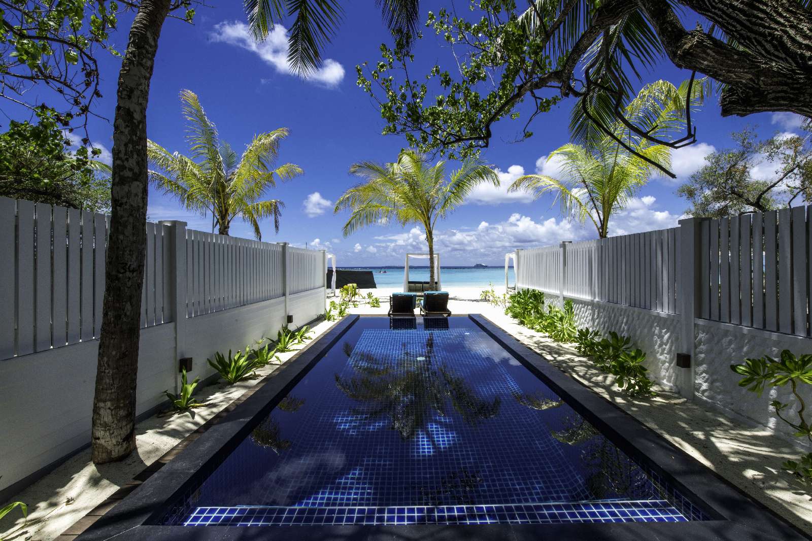 Paradise Island Resort paradiseislandsunset-beach-pool-villa-exterior.jpg